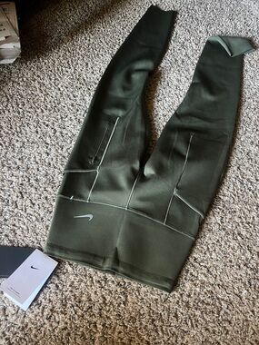 Nike Dark Olive Green Compression Leggings with Side Zip Pockets